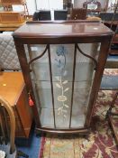 A VINTAGE SINGLE DOOR DISPLAY CABINET