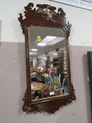 A GEORGIAN STYLE MAHOGANY WALL MIRROR WITH EAGLE SURMOUNT