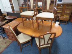 A MID-CENTURY TEAK 'G-PLAN' DINING TABLE WITH SIX MODERN CHAIRS