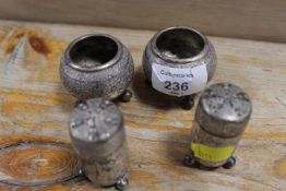 A CONTINENTAL WHITE METAL FOUR PIECE CRUET SET