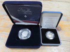 A BOXED SILVER PROOF CROWN ELIZABETH II AND THE QUEEN MOTHER VERSO TOGETHER WITH A BOXED SILVER