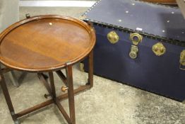 A VINTAGE BLUE PACKING TRUNK PLUS A CIRCULAR OAK CARD TABLE
