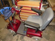 A SHOPRIDER MOBILITY SCOOTER WITH KEYS AND CHARGER