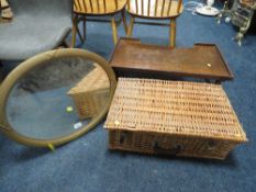 A VINTAGE WICKER BASKET TOGETHER WITH AN OVAL MIRROR AND A VINTAGE BED TABLE