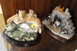 A COUNTRY ARTISTS FIGURE OF A TIGRESS AND CUBS ON A ROCK TOGETHER WITH A BORDER FINE ARTS FIGURE