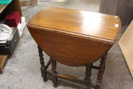 AN OAK BARLEYTWIST DROPLEAF TABLE