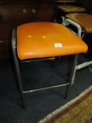 A MODERN ORANGE STOOL TOGETHER WITH A MODERN TAN LEATHER STOOL