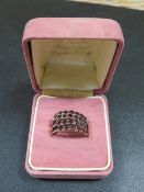 UNUSUAL GARNET SET RING MARKED '14'