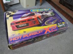 A BOXED SCALEXTRIC HOT PURSUIT X2 - CONTENTS UNCHECKED