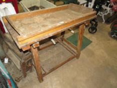 A VINTAGE WOODEN TRESTLE BENCH WITH MANGLE ATTACHMENT ETC