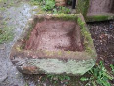 A LARGE SQUARE SANDSTONE TROUGH 64 X 64 CM