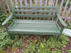 A PAINTED GREEN WOODEN GARDEN BENCH