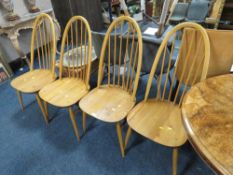 A SET OF FOUR HOOP BACK ERCOL CHAIRS
