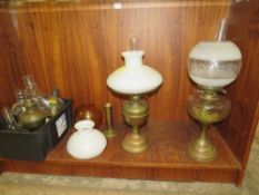 AN ASSORTMENT OF PARAFFIN LAMPS AND ACCESSORIES ETC