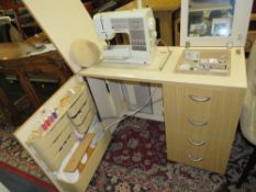 A BERNINA 1130 SEWING MACHINE IN FITTED CABINET WITH CONTENTS / ACCESSORIES