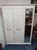 A MODERN CREAM TRIPLE WARDROBE