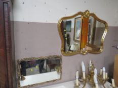 A MODERN GILT SHAPED WALL MIRROR W-102 CM TOGETHER WITH ANOTHER MIRROR (2)