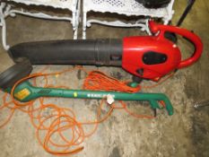 A BLACK & DECKER STRIMMER TOGETHER WITH A RED GARDEN VAC