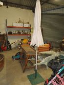 A GARDEN PARASOL WITH STAND