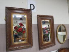 A PAIR OF OAK FRAMED GYPSY MIRRORS TOGETHER WITH AN OVAL GILT FRAMED MIRROR (3)