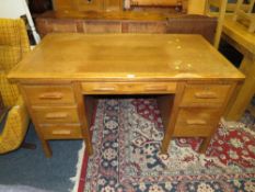 A MID CENTURY OAK TWIN PEDESTAL DESK A/F - W 137 CM