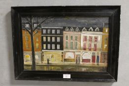 AN OIL ON BOARD OF A STREET SHOP SCENE IN EBONISED FRAME