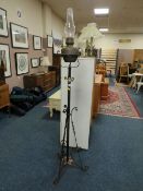 AN ANTIQUE WROUGHT LAMP STANDARD