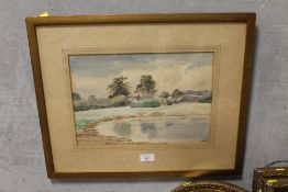 A FRAMED AND GLAZED WATERCOLOUR OF A POOLSIDE COTTAGE INDISTINCTLY SIGNED LOWER RIGHT