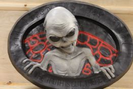 A LARGE SHOP DISPLAY OF AN ALIEN