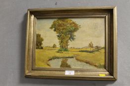 A SMALL GILT FRAMED OIL ON BOARD OF A RURAL RIVER LANDSCAPE