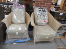 A PAIR OF MODERN LLOYD LOOM WICKER ARMCHAIRS WITH CUSHIONS