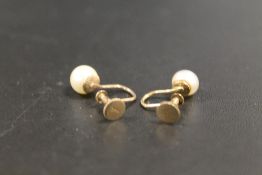 A PAIR OF SCREW BACK CLIP ON PEARL EARRINGS STAMPED 9CT