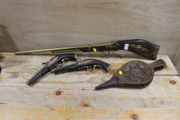 THREE DECORATIVE MODEL GUNS (TWO PISTOLS AND A RIFLE) PLUS A SMALL SET OF BELLOWS