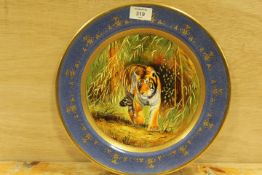 A SIGNED, HANDPAINTED AND GILDED COALPORT PLATE FEATURING A TIGER SIGNED M PINTER