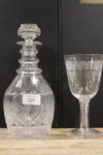 AN ETCHED TWIST STEM WINE GLASS A/F TOGETHER WITH A DECANTER (2)
