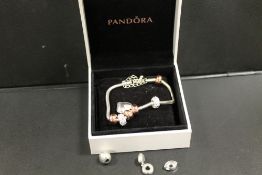 A PANDORA STYLE BRACELET AND CHARMS