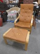 A MODERN EASY ARMCHAIR WITH FOOTSTOOL