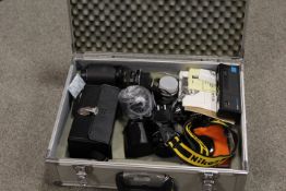 A HARD SHELL TRAVEL CASE CONTAINING ASSORTED PHOTOGRAPHIC EQUIPMENT TO INCLUDE NIKON CAMERA , LENSES