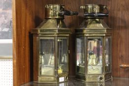 A PAIR OF VINTAGE BRASS CARRIAGE LANTERNS