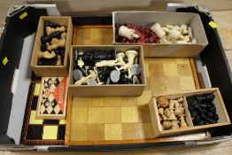 A BOX OF VINTAGE CHESS PIECES, BOARDS ETC