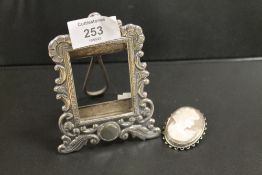 A SILVER PICTURE FRAME TOGETHER WITH A HALLMARKED SILVER CAMEO (2)