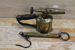 A VINTAGE BRASS BLOW LAMP TOGETHER WITH VINTAGE HANGING SCALES