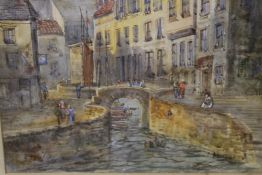 A GILT FRAMED AND GLAZED WATERCOLOUR OF A CONTINENTAL TOWN WITH LARGE CATHEDRAL TO THE BACKGROUND,