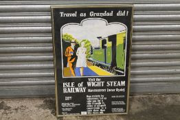 A FRAMED AND GLAZED REPRODUCTION ISLE OF WIGHT STEAM RAILWAY POSTER