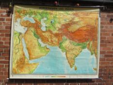 A LARGE ROLLABLE WALL MAP BY GEORGE WESTERMANN SHOWING THE MIDDLE EAST AND INDIA - APPROX 194 X