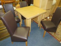 A MODERN EXTENDING DINING TABLE & FOUR CHAIRS