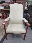 AN UPHOLSTERED ARMCHAIR