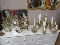 A BRASS LANTERN LIGHT FITTING TOGETHER WITH TWO HEAVY CHANDELIERS A/F