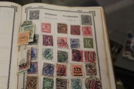 A STAMP ALBUM AND CONTENTS