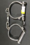 A PAIR OF VINTAGE HIATT BEST HAND CUFFS WITH KEY